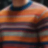 A detailed close-up of a colorblock striped sweater showcasing intricate patterns