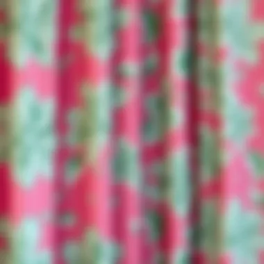 Close-up of intricate floral patterns on a pink and green shower curtain