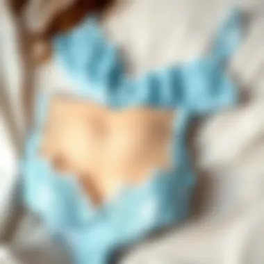 Aesthetic display of light blue lace lingerie on a soft background