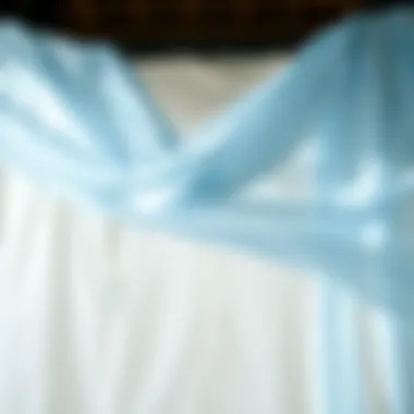 Elegant draping of light blue cheesecloth in a fashion design.