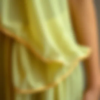 Close-up of tulip hem detailing on a chiffon dress