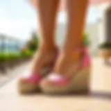Elegant pink espadrille wedges on a sunny terrace