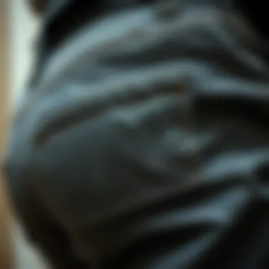 A close-up view of intricate pants crotch patches showcasing detailed stitching and fabric texture.