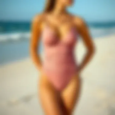 Elegant ruched bottom one piece swimsuit displayed on a sandy beach