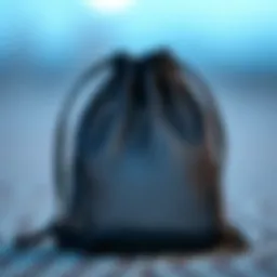 Close-up view of a small mesh drawstring bag displaying intricate design details