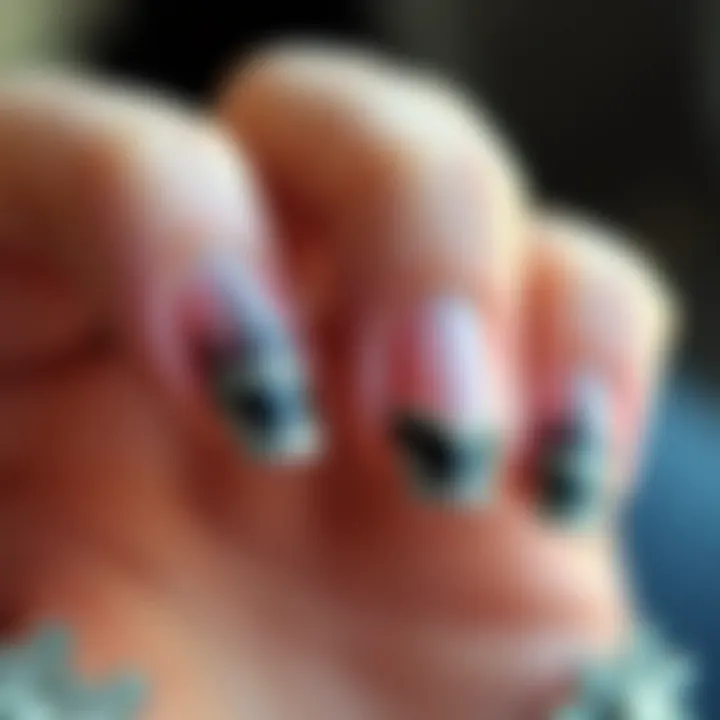 Close-up of U-shape nails with intricate nail art
