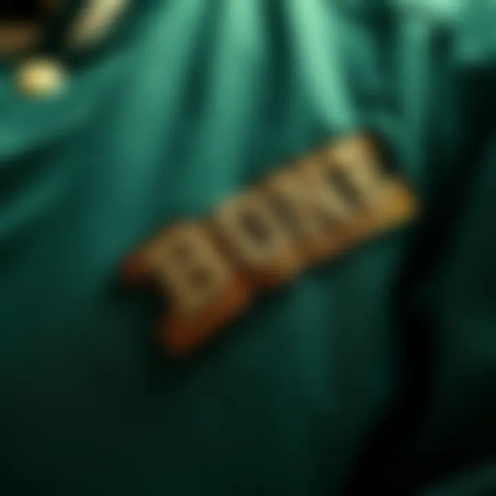 Close-up of the intricate stitching and material of the green bone varsity jacket