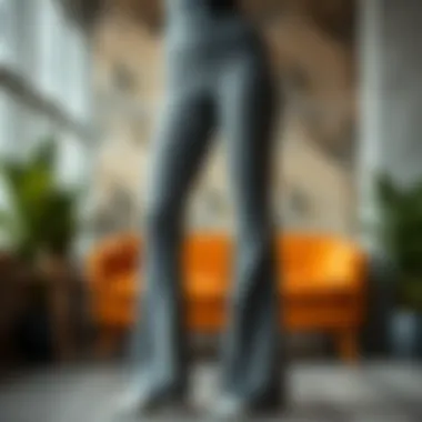 A pair of elegant grey bootcut yoga pants displayed on a stylish backdrop.