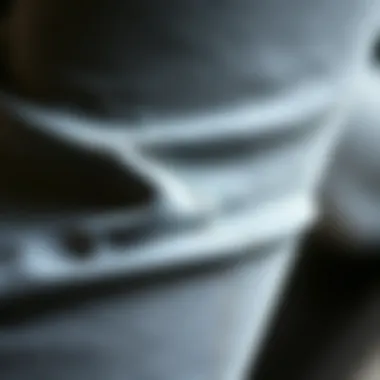 Close-up of the fabric texture of grey bootcut yoga pants, showcasing quality and comfort.