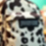 Close-up view of the Jansport cow print backpack showcasing its unique fabric texture