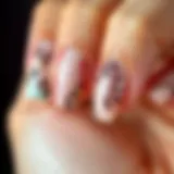 Close-up view of tapered square press-on nails showcasing intricate designs and colors