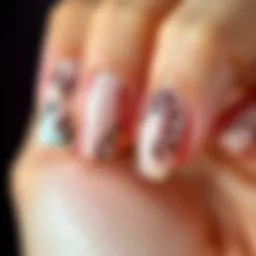 Close-up view of tapered square press-on nails showcasing intricate designs and colors