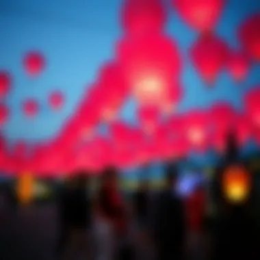 A festive gathering featuring pink sky lanterns, symbolizing celebration and joy