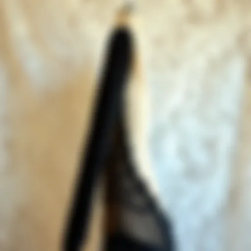 Elegant long sleeve black lingerie displayed on a delicate lace background