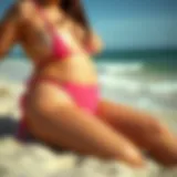 Vibrant plus thong swimsuit on a sandy beach