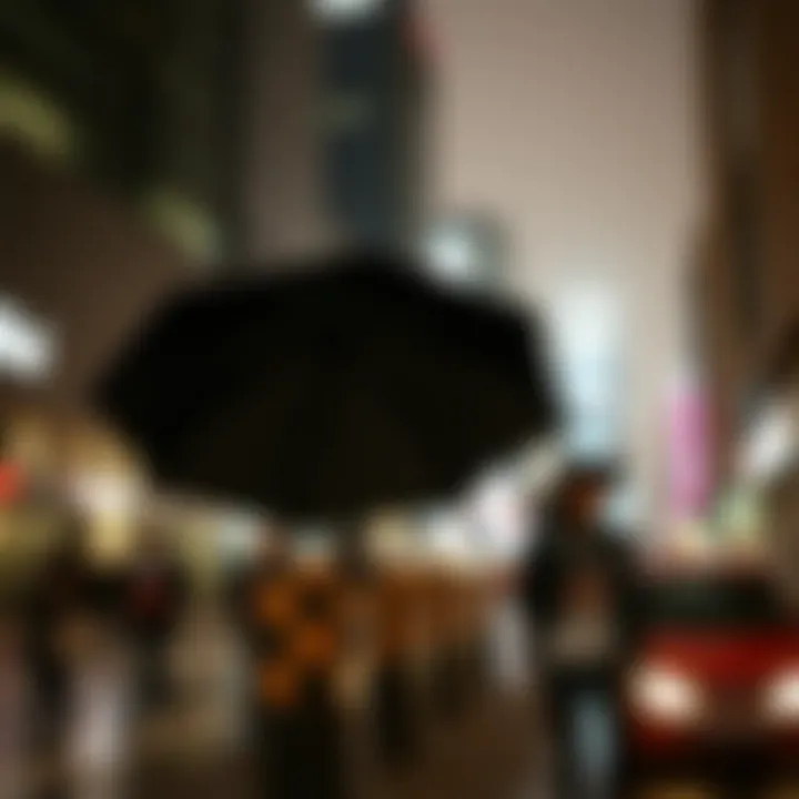 A stylish individual holding a pocket umbrella against a rainy city backdrop