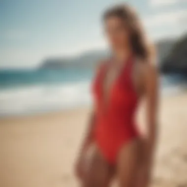 A vibrant red halter swimsuit displayed against a sunlit beach backdrop