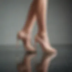 Elegant nude high heels on a reflective surface