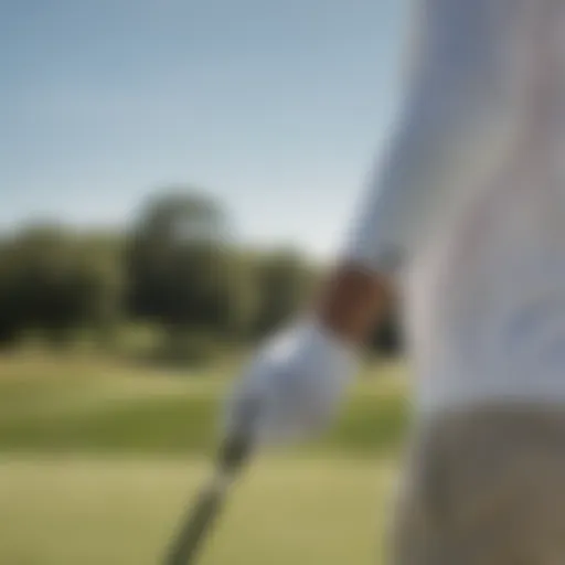 Close-up of a golfer wearing UV arm sleeves under sunlight